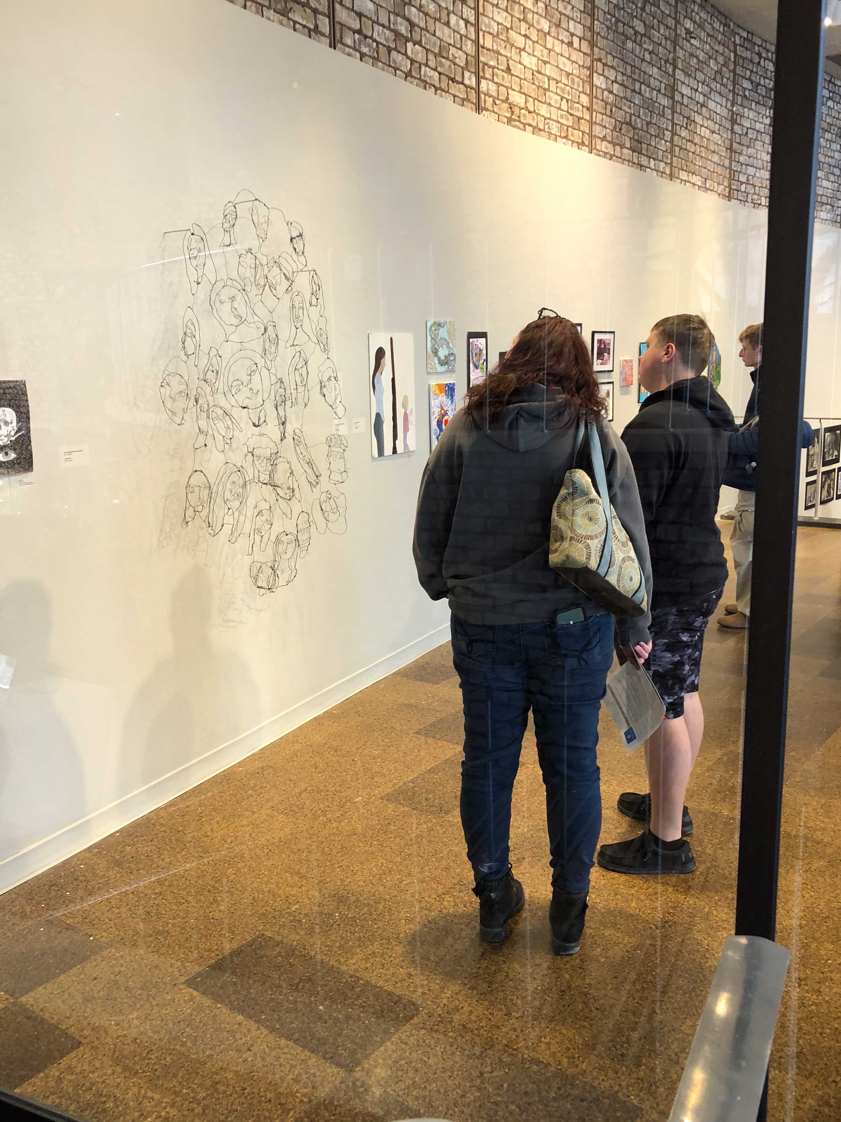 Guests observe C-RHS' art piece